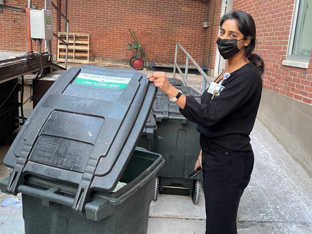reduction in motion employee with compost bin