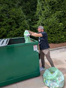 Zach recycling green bag