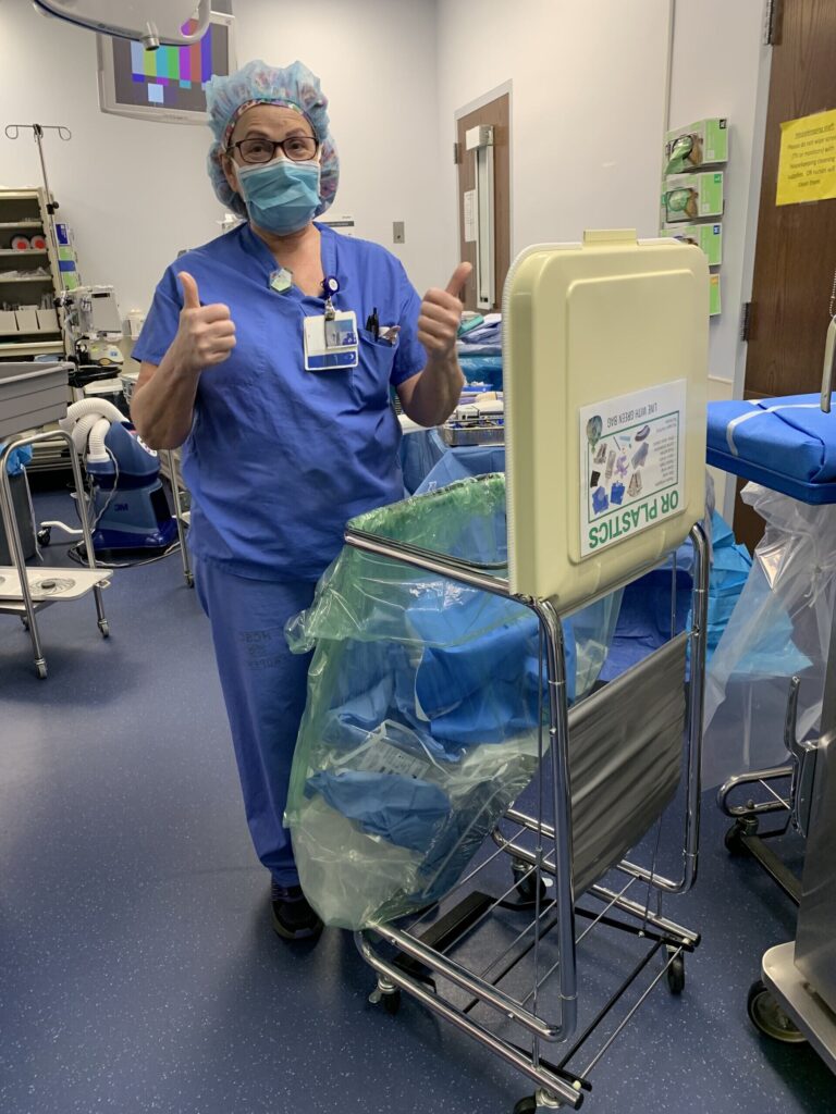 Healthcare worker in front of waste